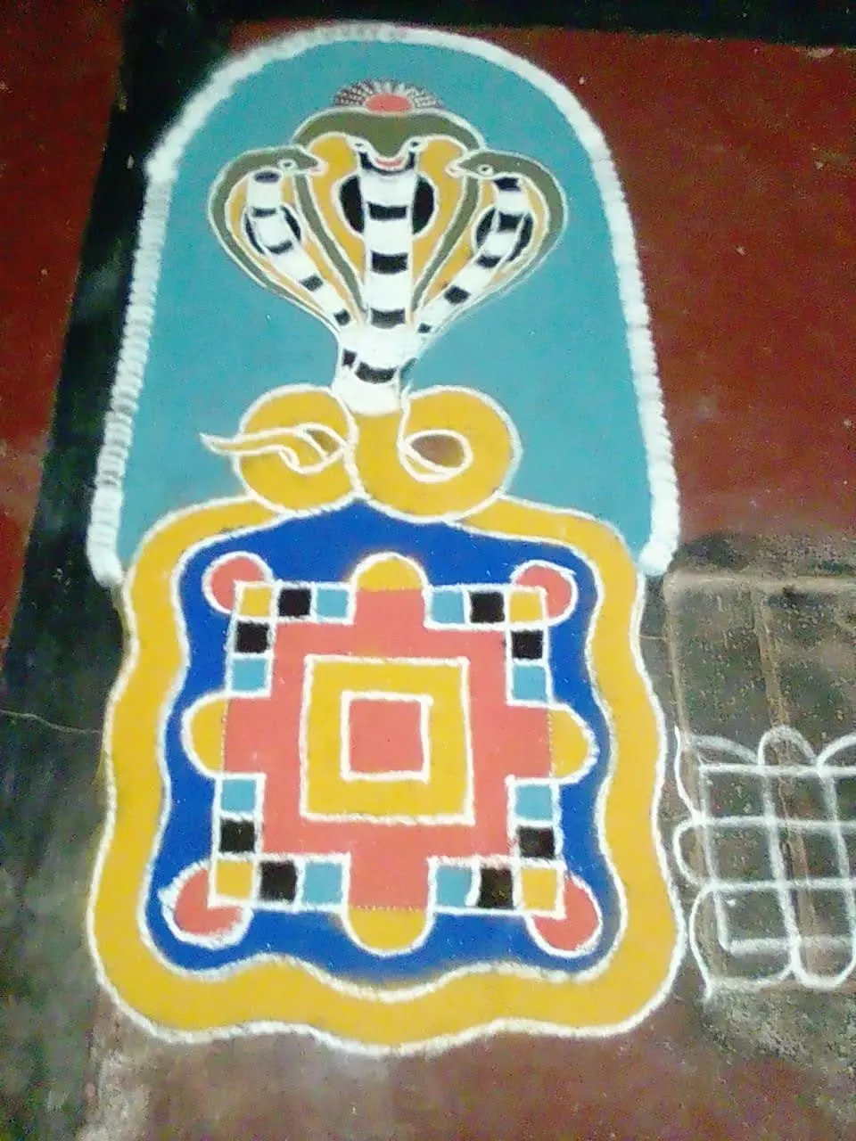 A Naga mandala in coloured powder